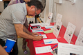 Bidding on Silent Auction items. :: &copy; Javier Domínguez